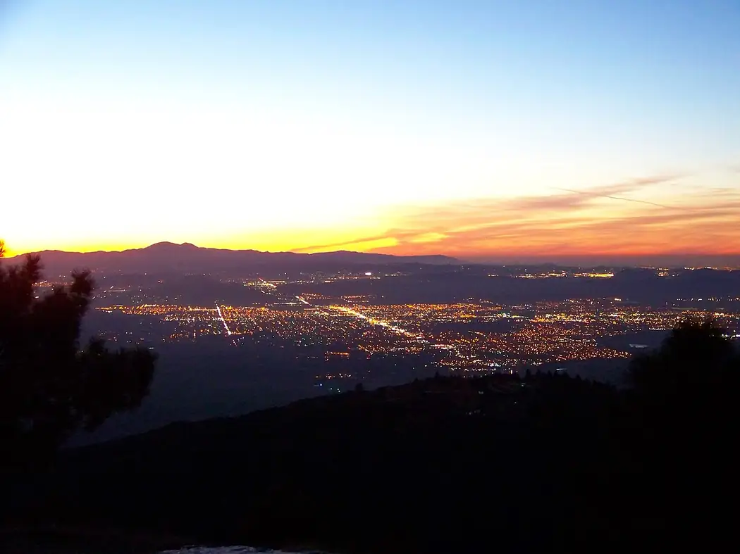 The San Jacinto Valley and the lights of Hemet at dusk, seen from a viewpoint in Idyllwild, California