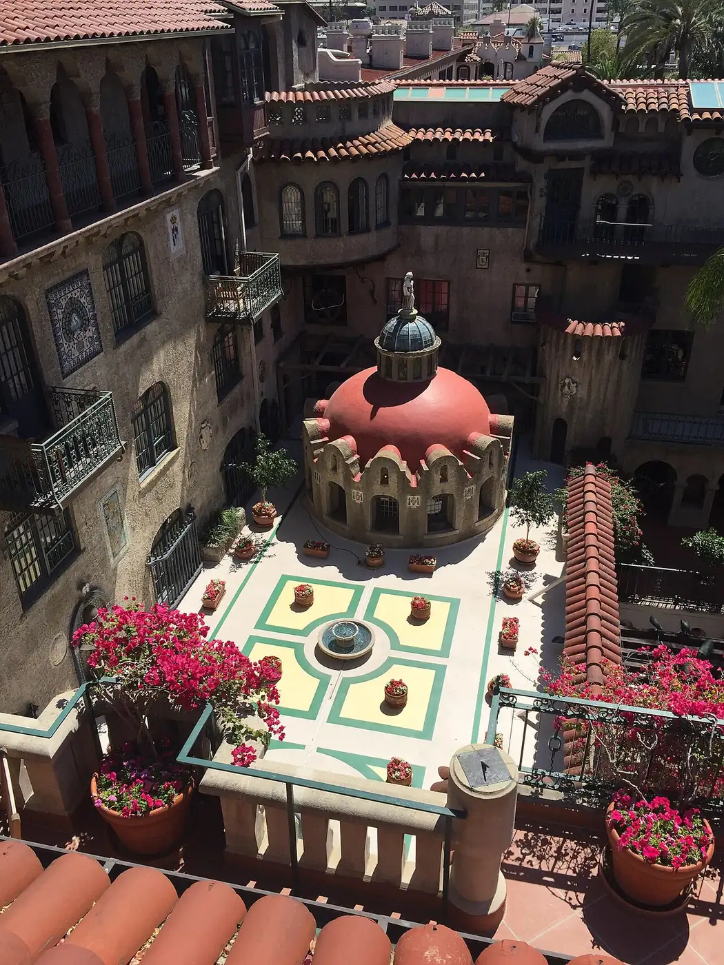 The central plaza of the Mission Inn Hotel and Spa in downtown Riverside, California, seen from a rooftop parapet
