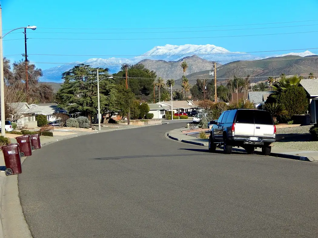 Snow-capped Mount San Jacinto rising above a residential street on the San Jacinto Valley floor in Riverside County, California